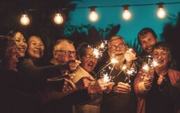 adults enjoying sparklers