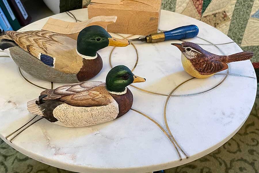 wooden ducks at an art show