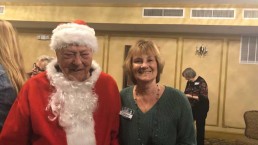 man in Santa costume with a woman